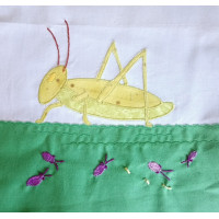 An applique pattern for a grasshopper